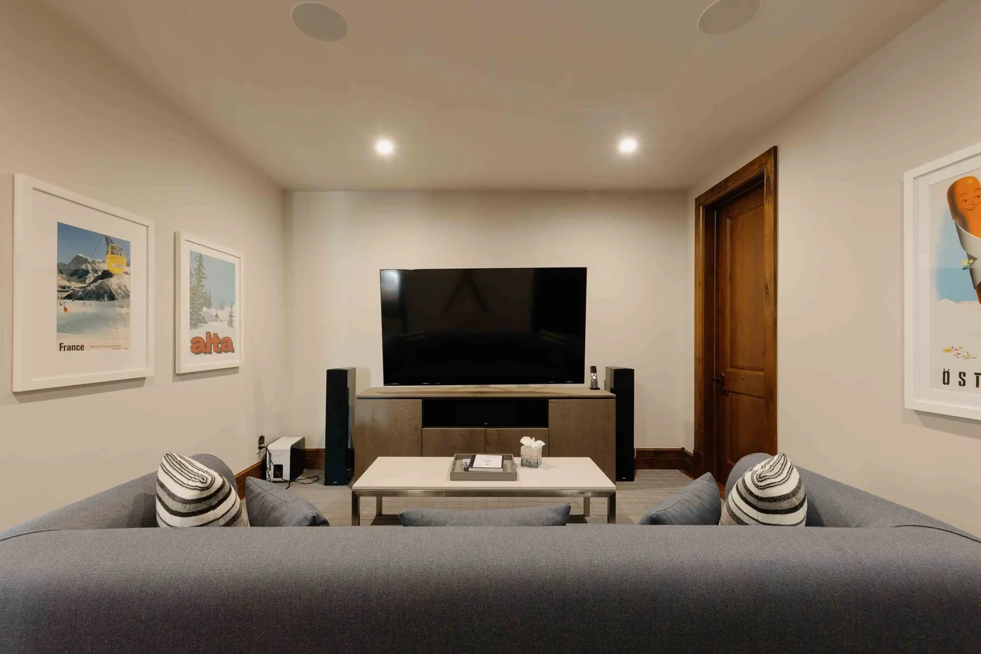 A living room with a television, low table, and seating.