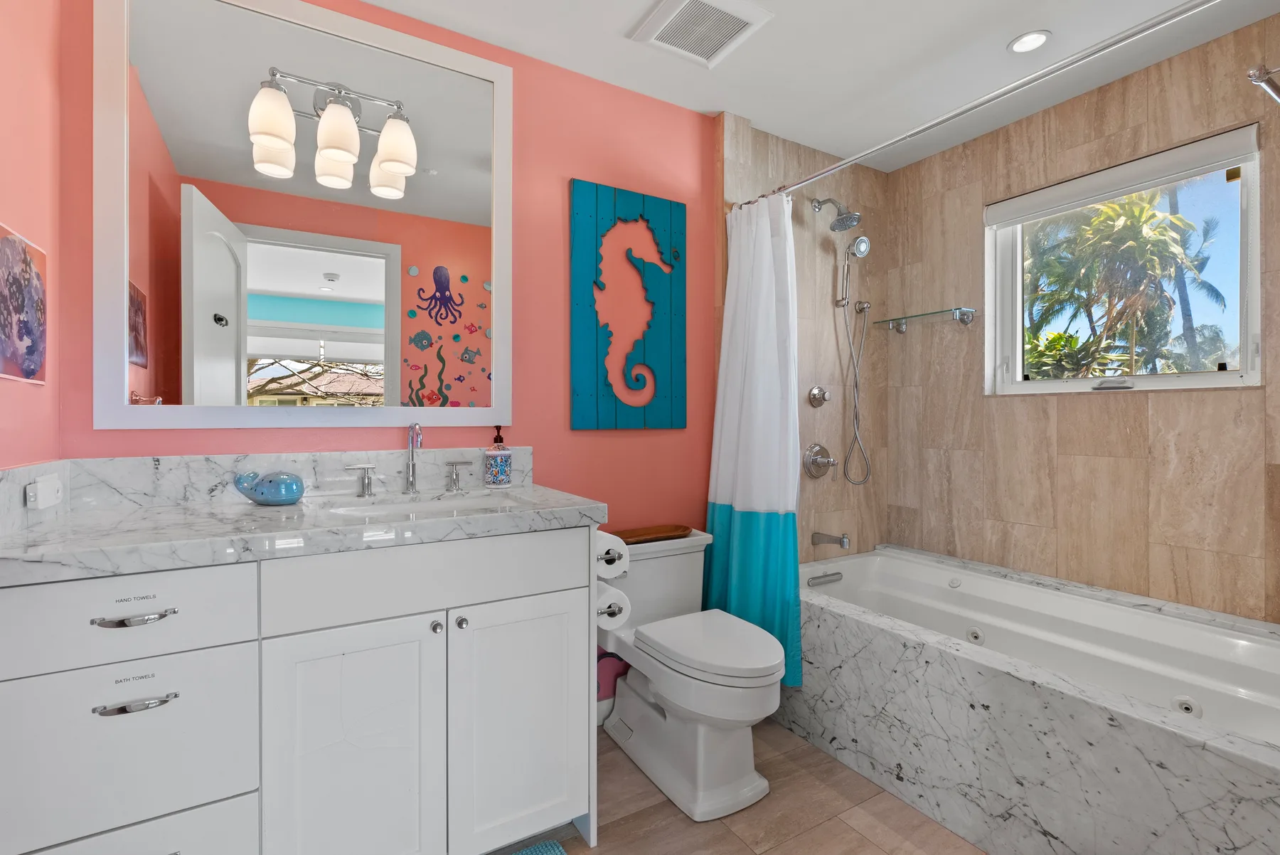 Un baño con lavabo, inodoro y bañera junto a una ventana.