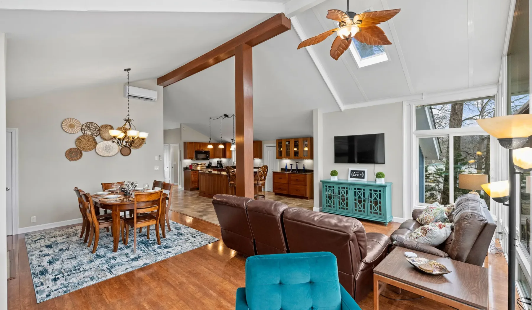 An open-plan living and dining area with seating and a dining table.