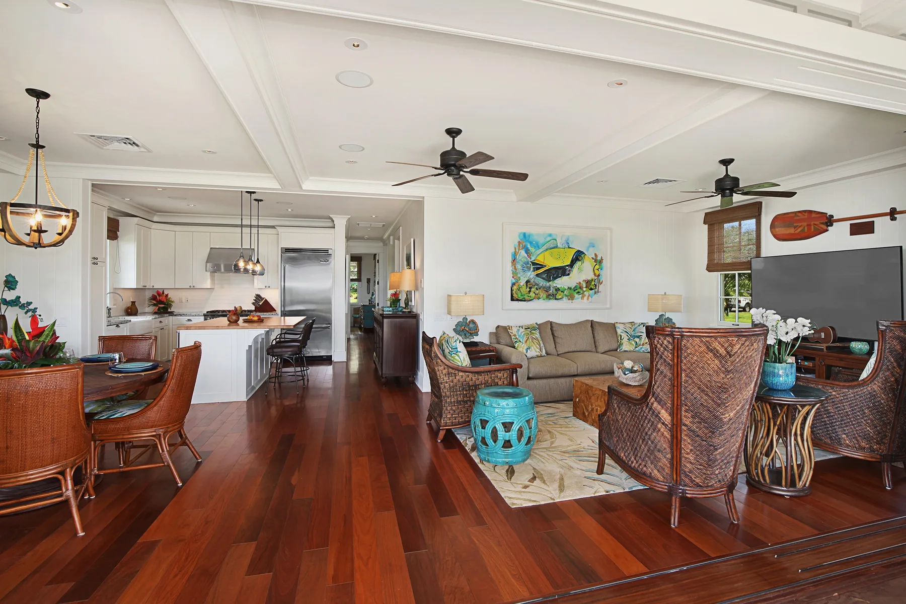 An open-plan living and dining area with a kitchen at the back.