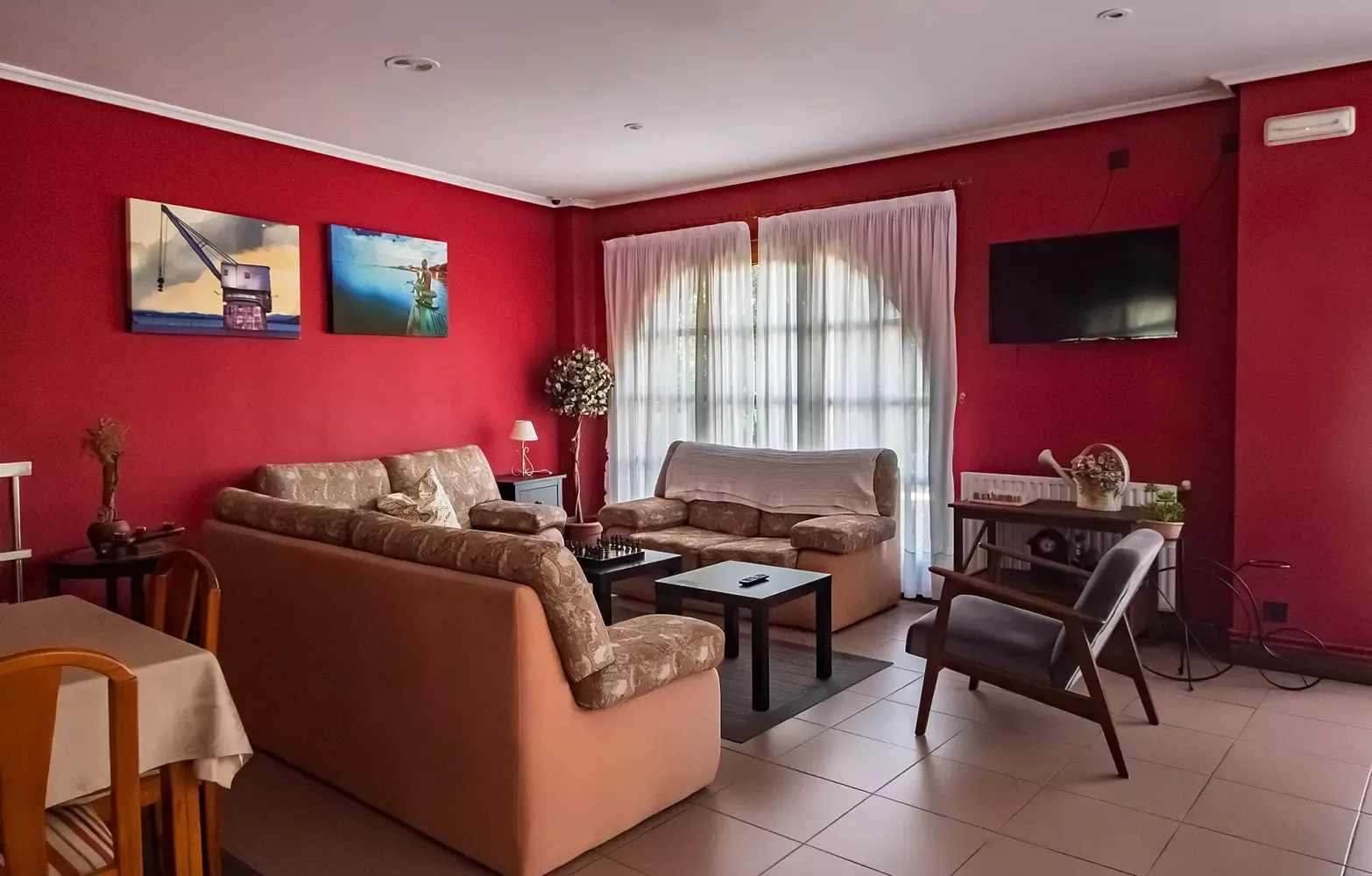 Shared lounge with television and reading area