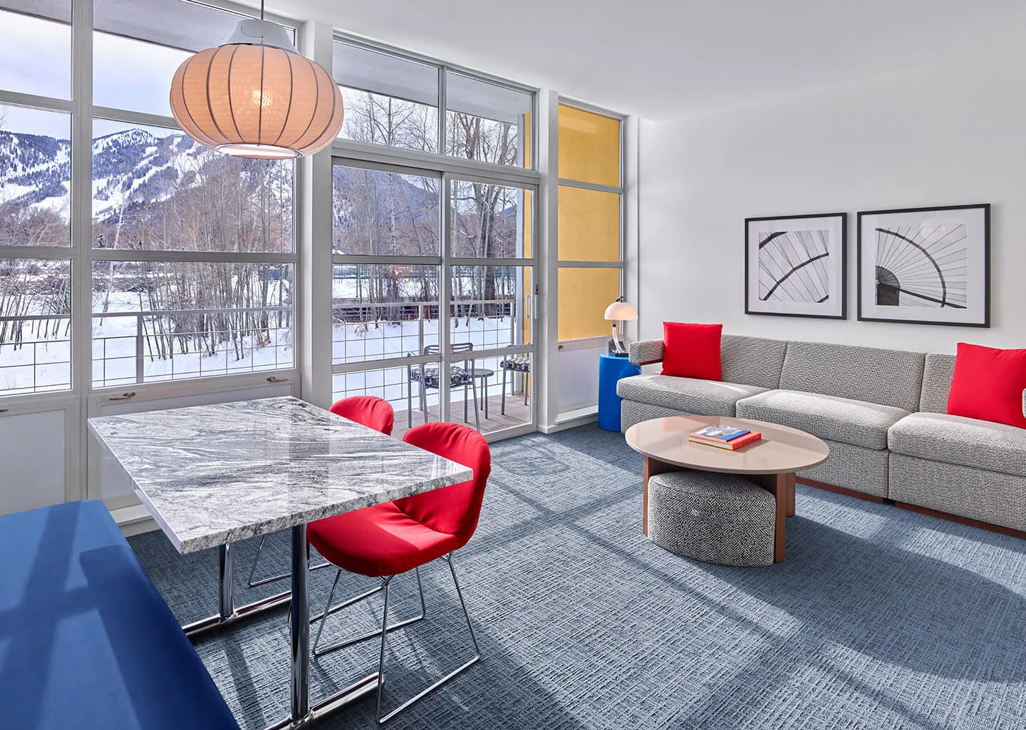 Room with a wall of windows and a deck