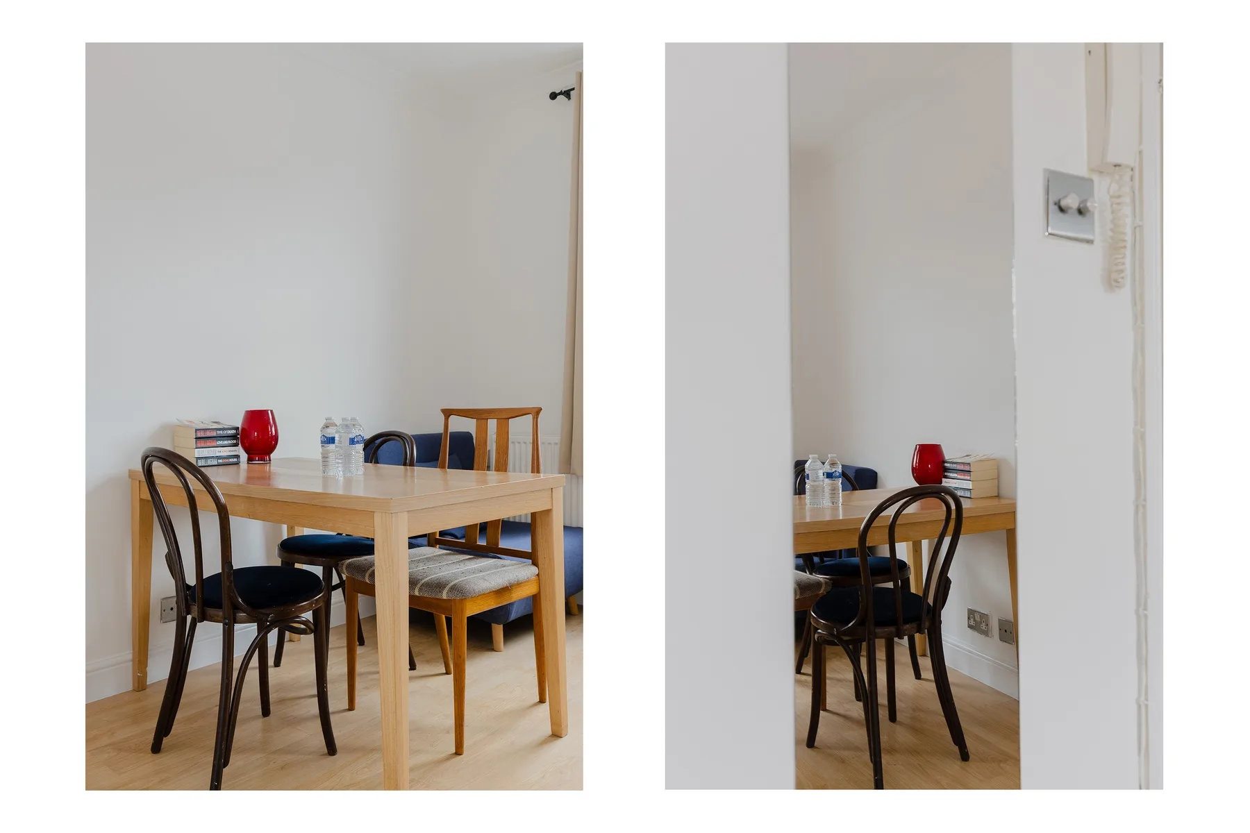 A dining area with a wooden table and several chairs.