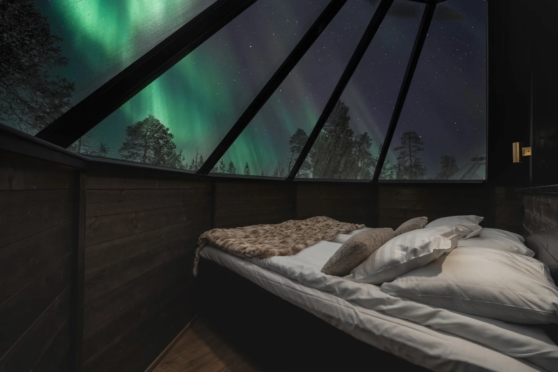 Aurora Premium Cabin interior beneath the northern lights