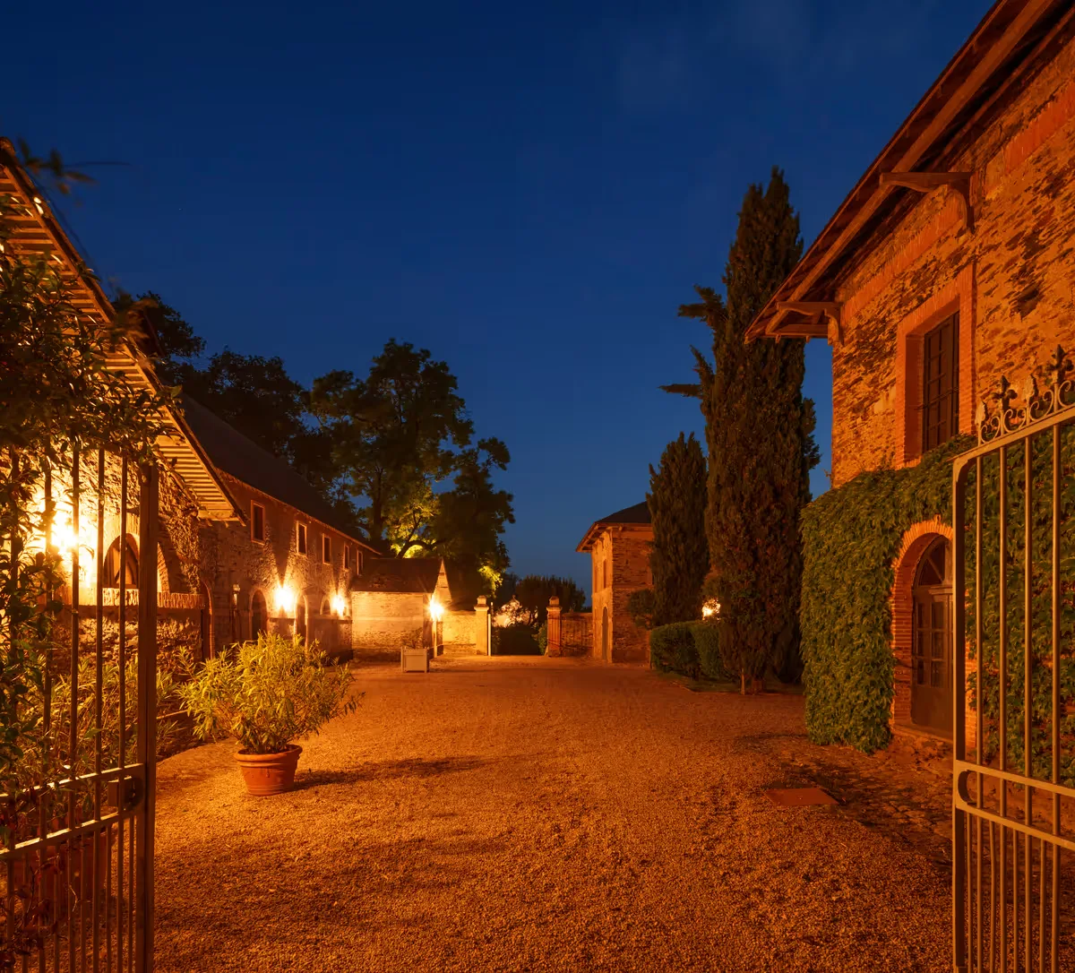Château exterior illuminated at dusk