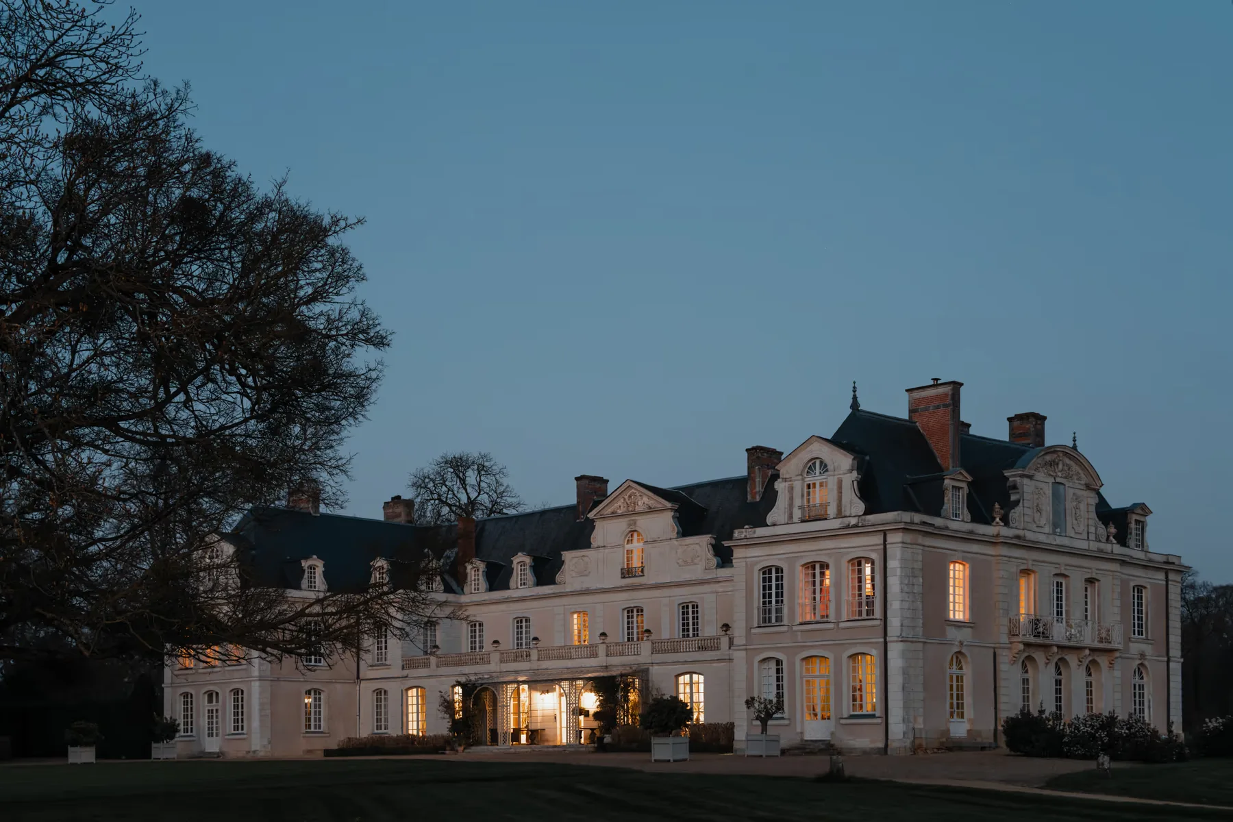 Château illuminated at dusk