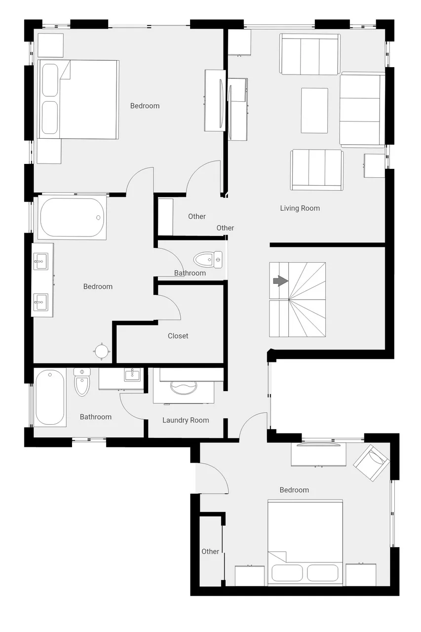 Un plano muestra varios dormitorios, baños, una sala de estar y una escalera central.