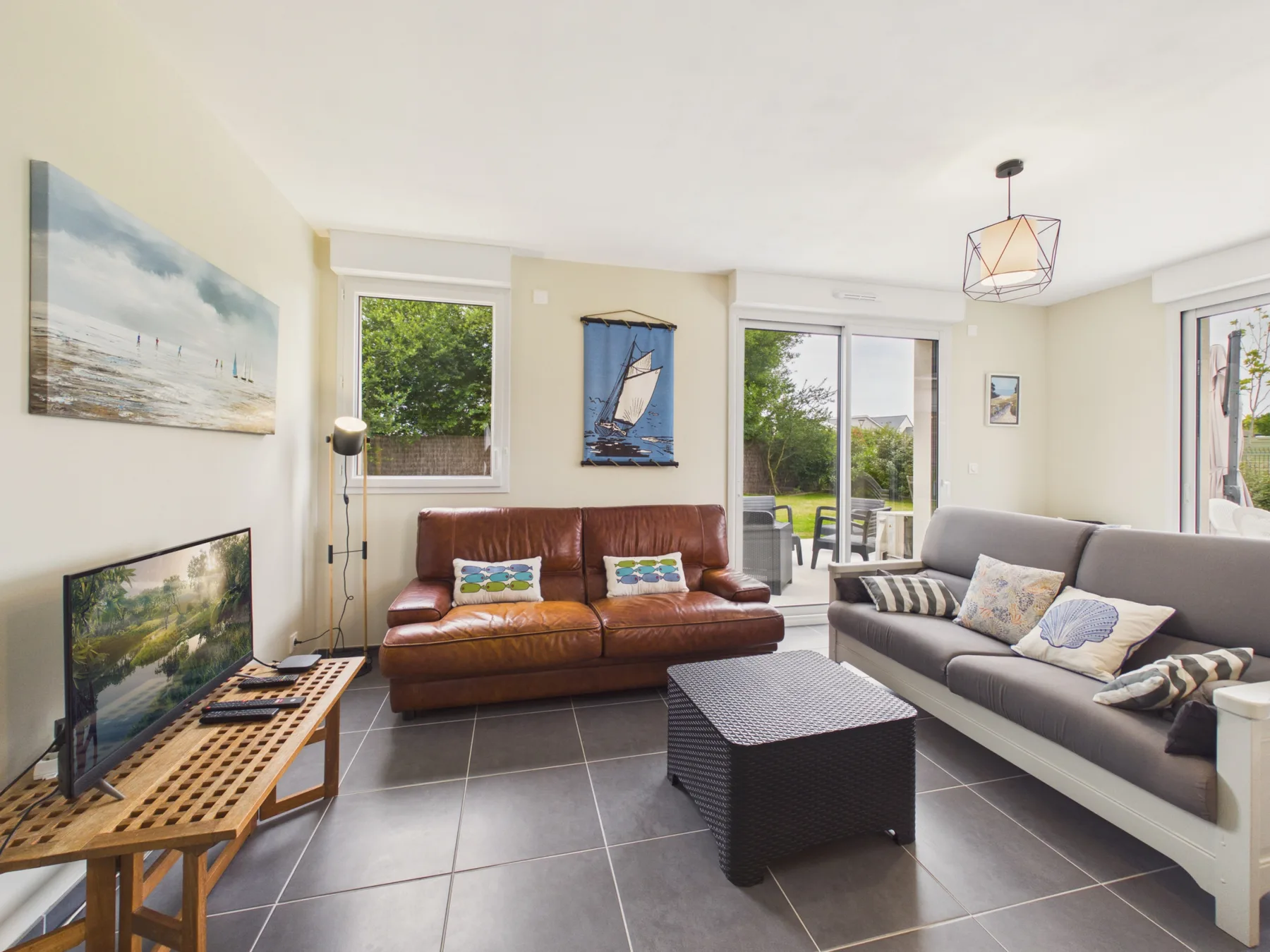 A bright living room with sofas and a coffee table.