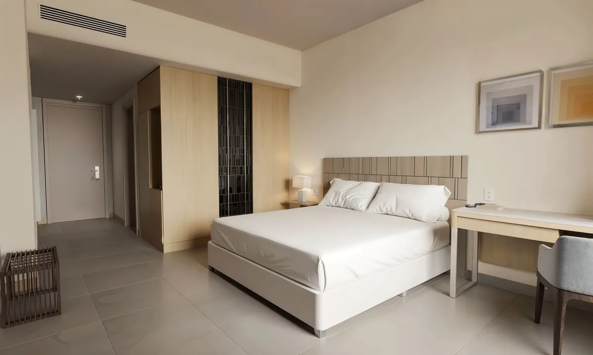 Representación digital de la habitación Signature con cama king y vista al mar