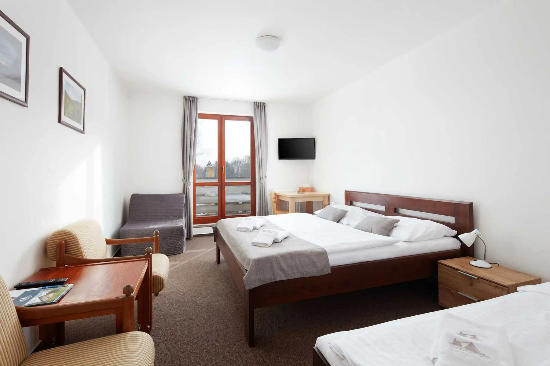 Three-bed room with extra bed