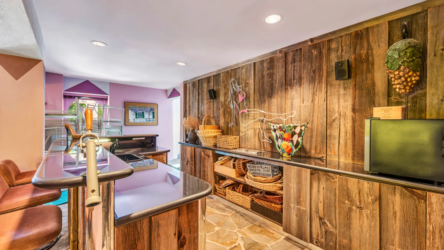 A colorful interior with a wooden counter, display shelves, and a television.