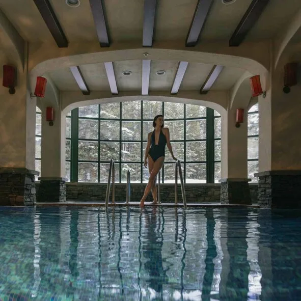 Guest standing in the indoor pool