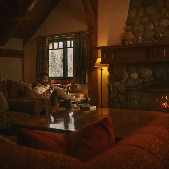 Guest reading on a sofa