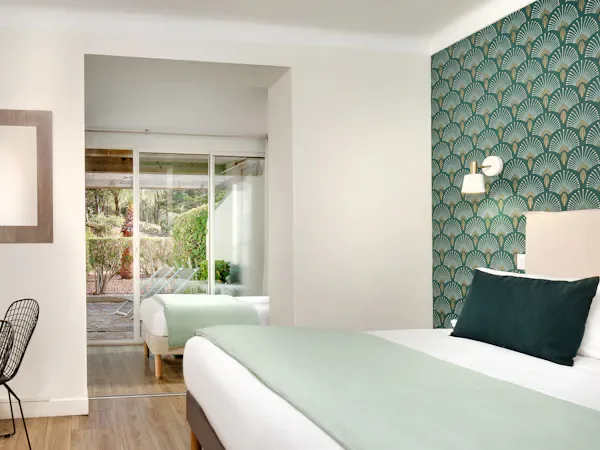 Wide view of the garden-view triple room