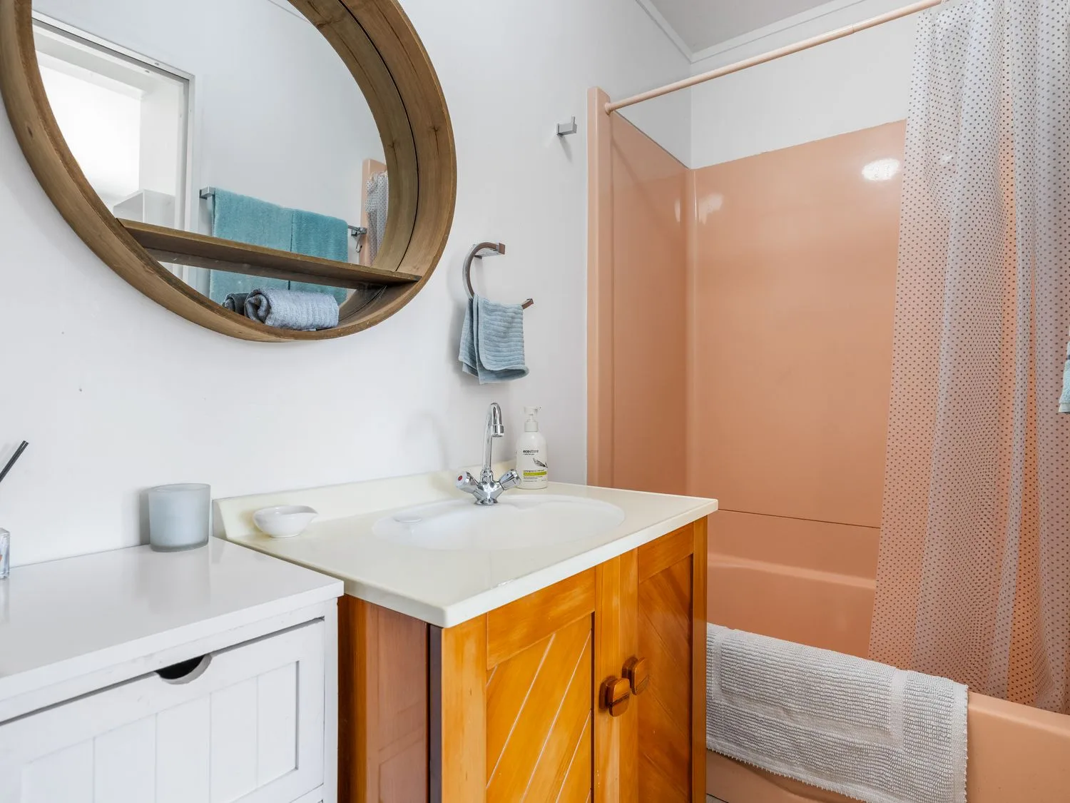A bathroom with a sink and shower at Harbour house - Whangamata Holiday Home