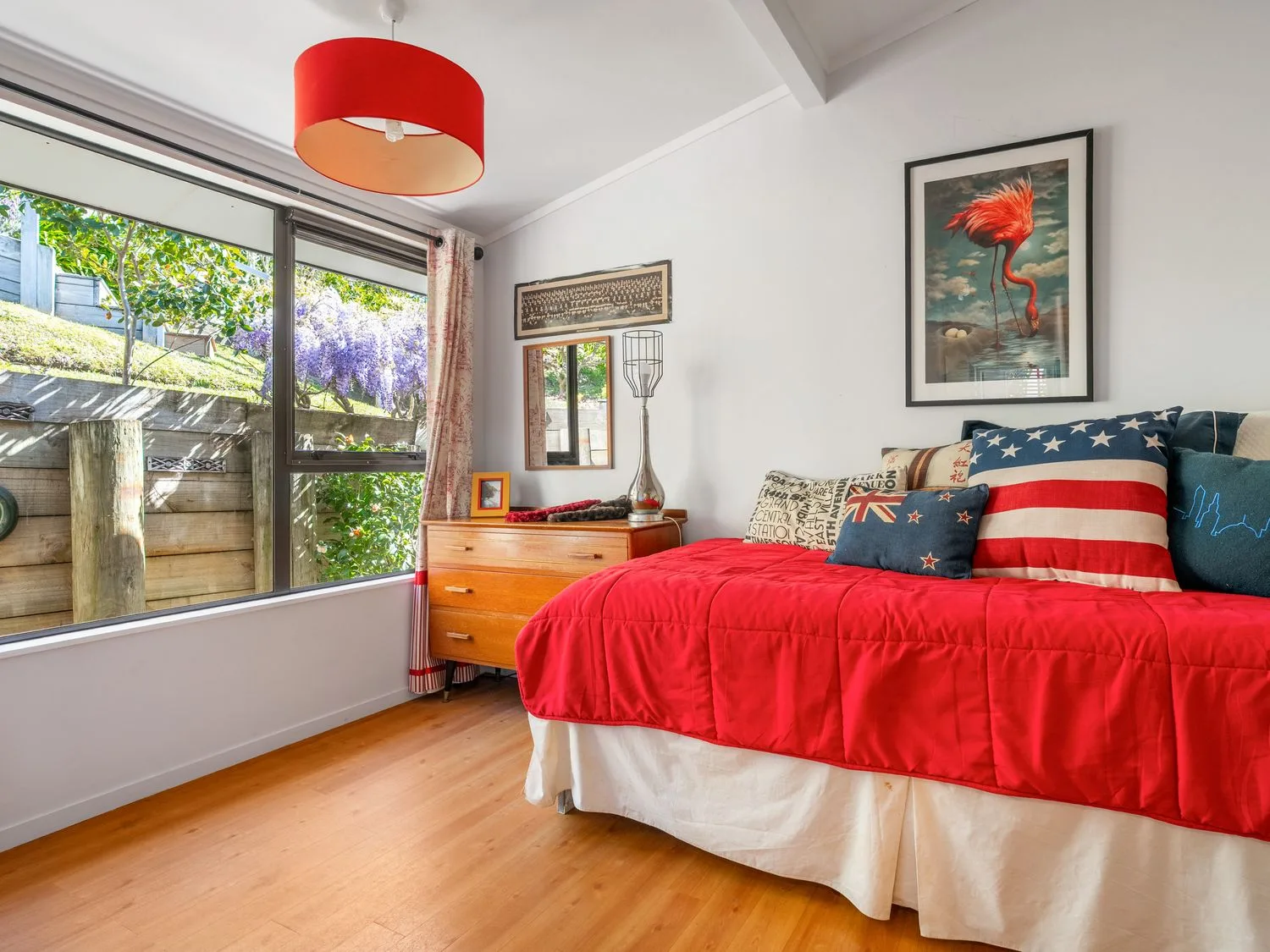 A bedroom with a bed and window at Harbour house - Whangamata Holiday Home