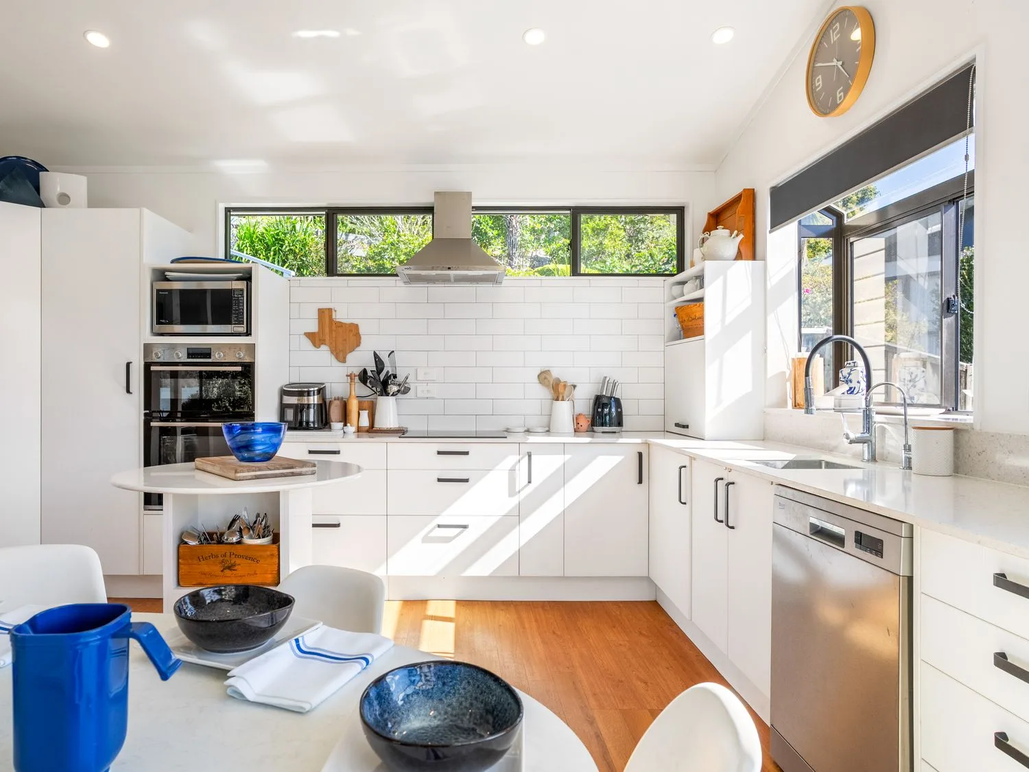 A kitchen with a sink and appliances at Harbour house - Whangamata Holiday Home
