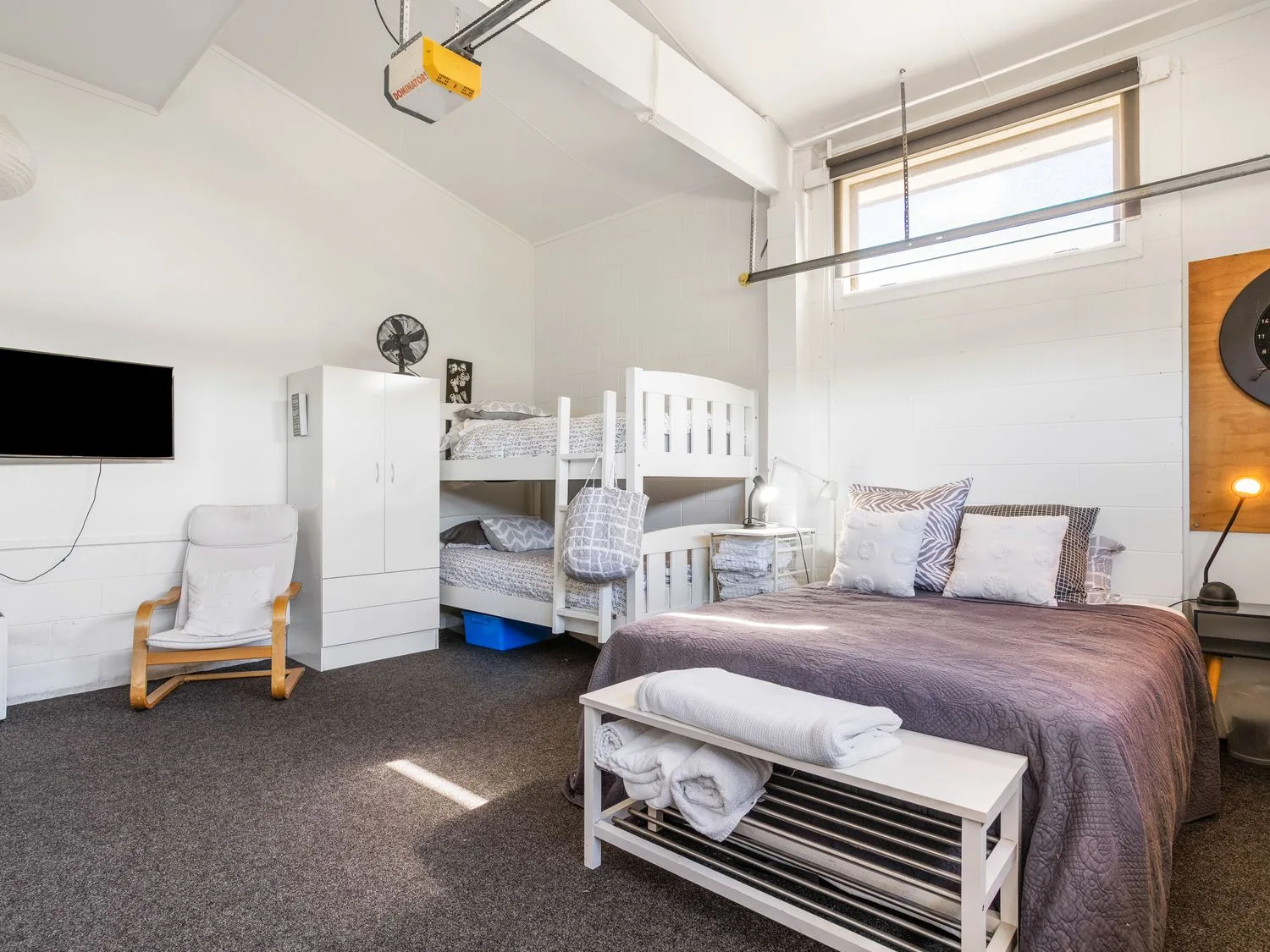 A bedroom with a bed and bunk bed at Harbour house - Whangamata Holiday Home