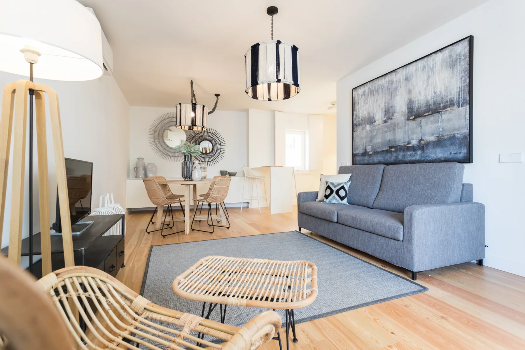A bright living and dining area with seating and a table.