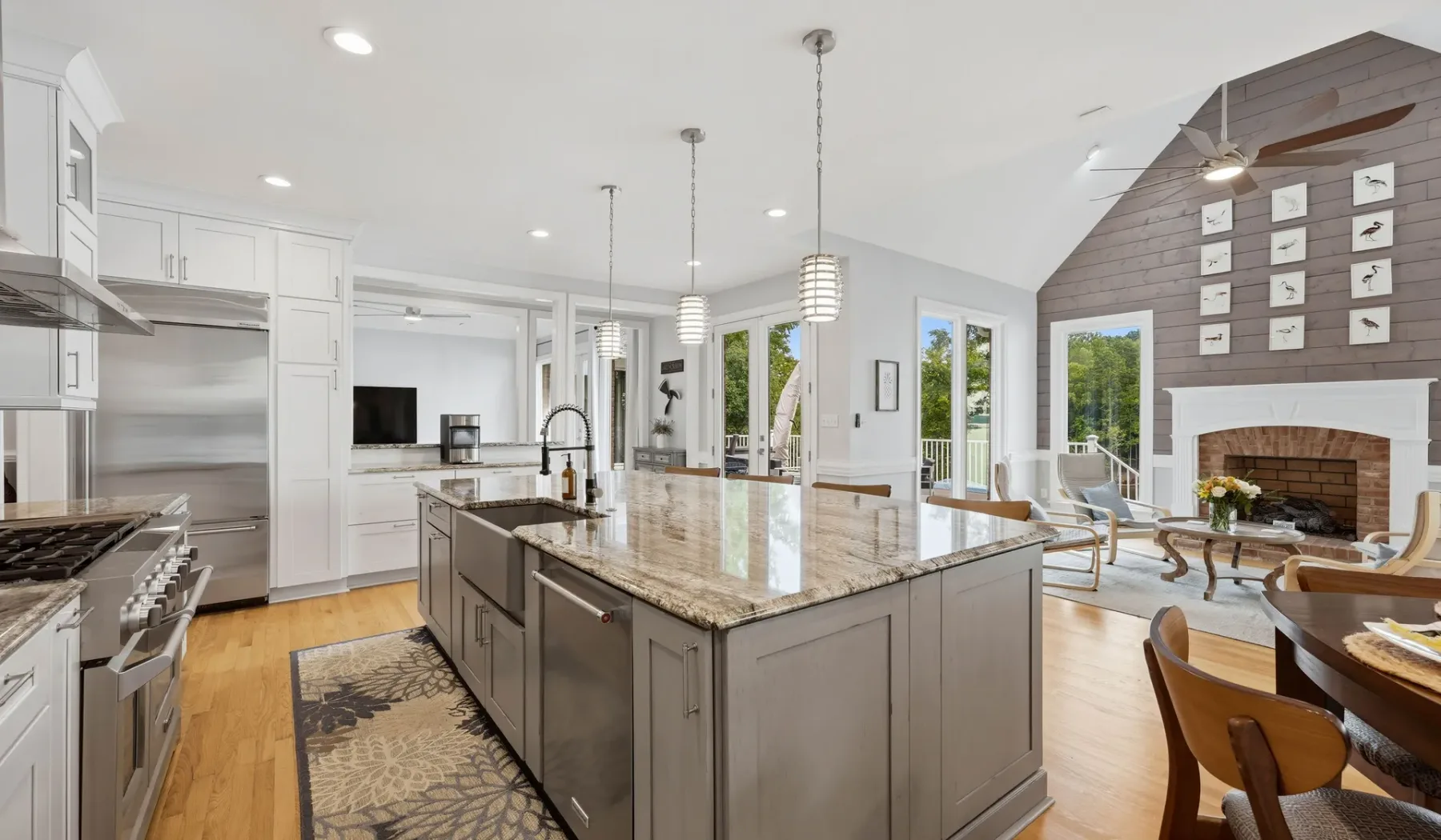 A bright open-plan kitchen and dining area with a large central island.
