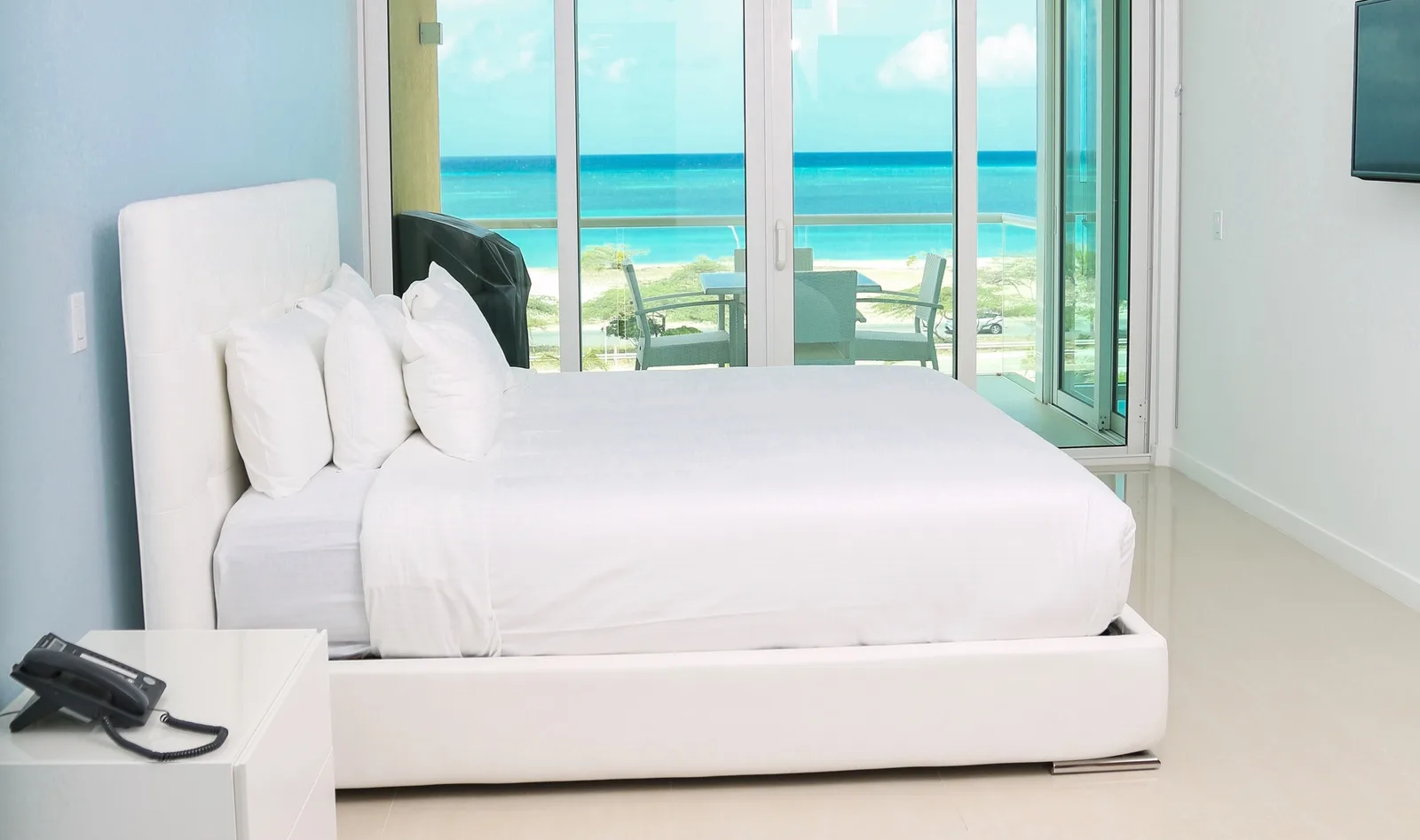 Wake up to breathtaking turquoise waters and soft white sand just steps from your private balcony. Your serene beachfront retreat awaits with fresh linens and stunning sea views.