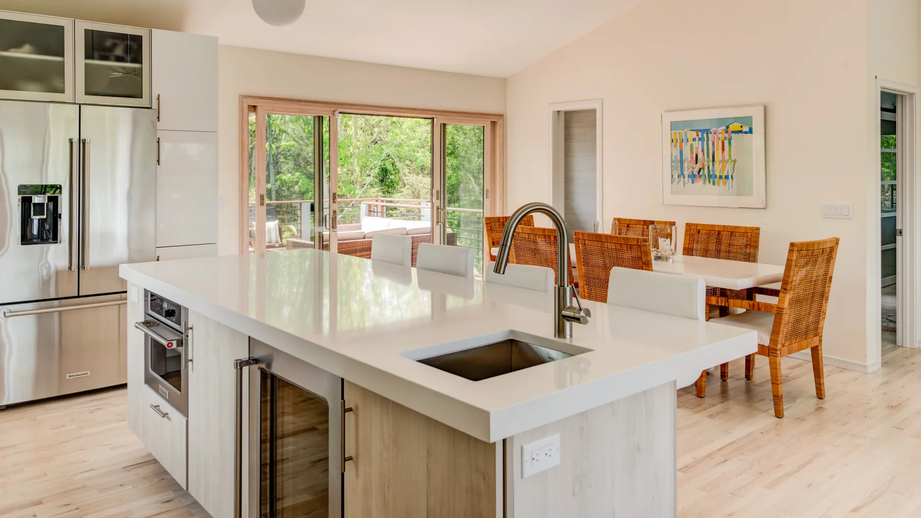 An open-plan kitchen and dining area with a large island and table.