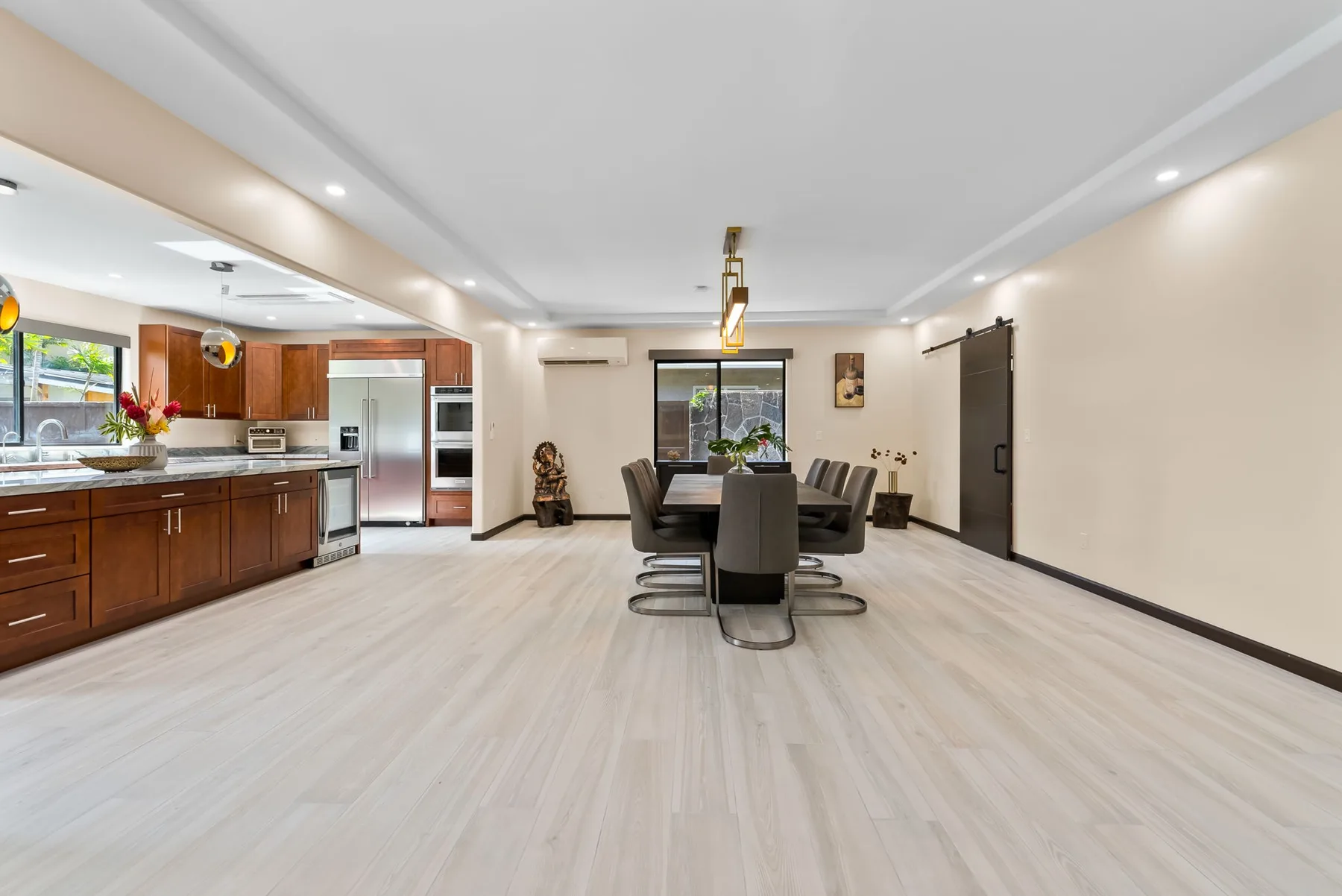 An open kitchen and dining area with a table and seating.