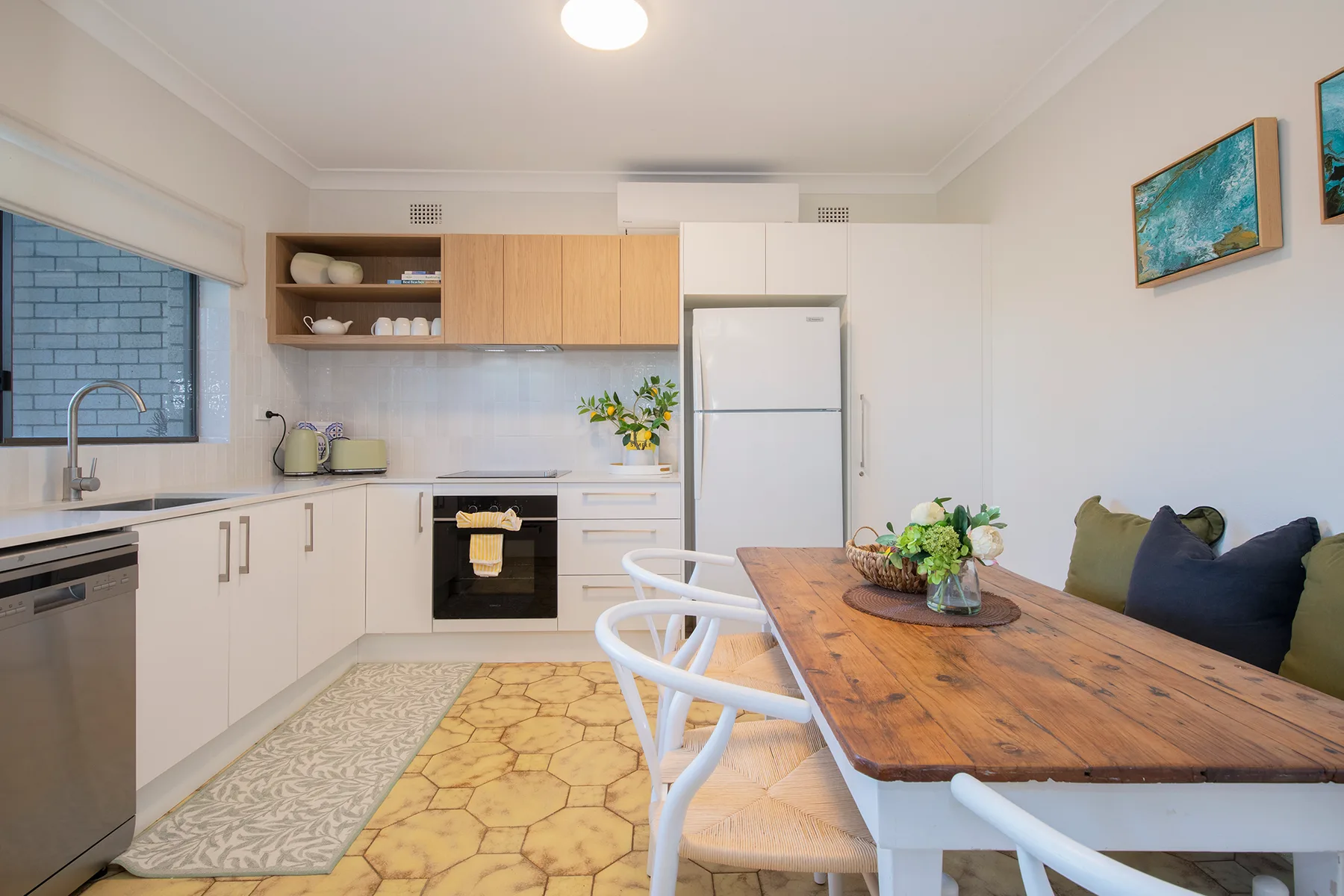 Gather around the generous timber dining table for leisurely breakfasts, home-cooked dinners or a glass of wine as the day winds down.