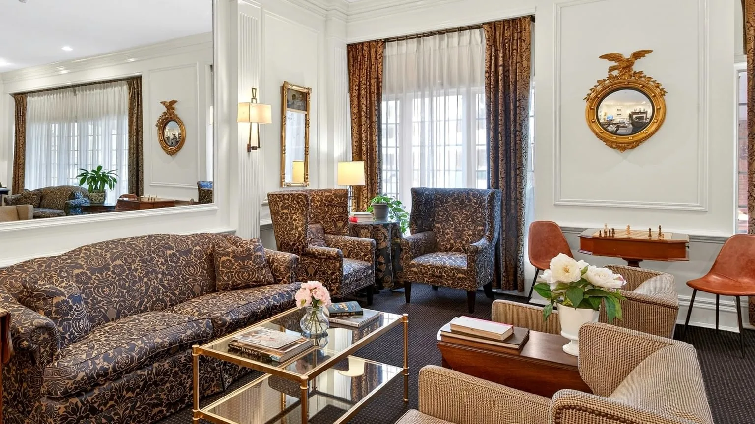 Hotel sitting area with sofa and armchairs