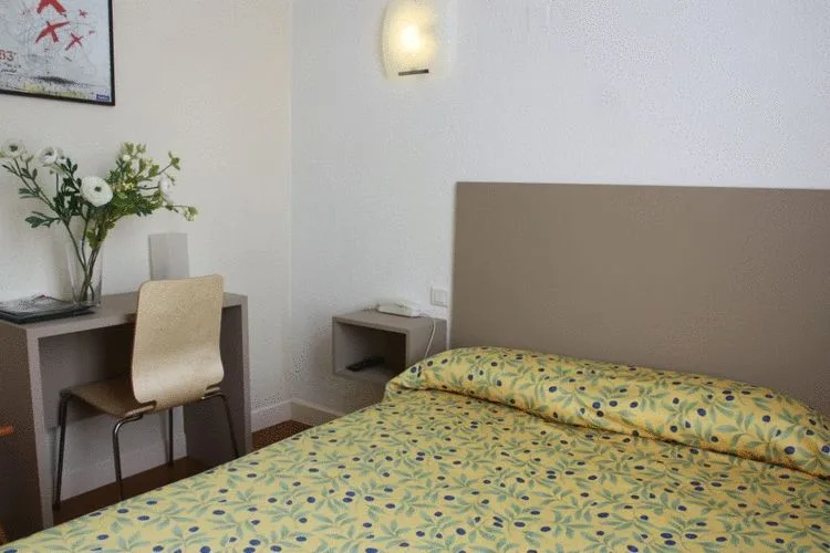 Room with one large bed and one single bed