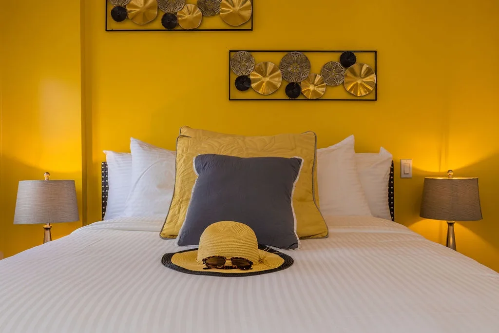 Wake to sunny yellow walls and fresh linens, with cheerful accents inviting your most relaxed vacation mood.