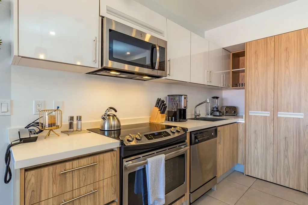 Your fully equipped kitchen features sleek stainless steel appliances, modern cabinetry, and ample counter space for preparing delicious home-cooked meals during your stay.