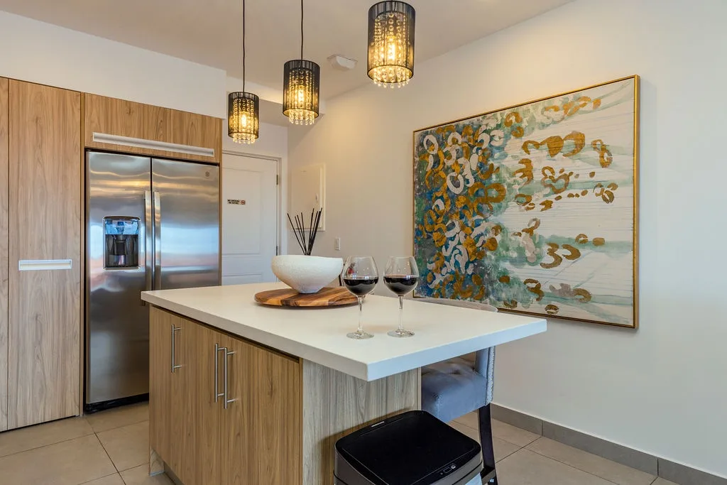 Your gourmet kitchen awaits with sleek modern appliances, elegant pendant lighting, and a stylish island perfect for savoring morning coffee or evening wine.