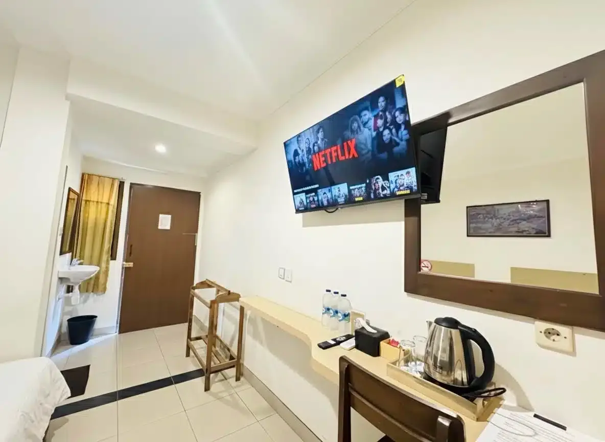 Habitación triple deluxe con vistas al jardín