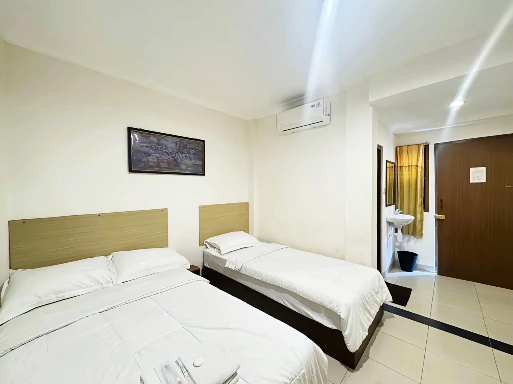 Habitación triple deluxe con vistas al jardín