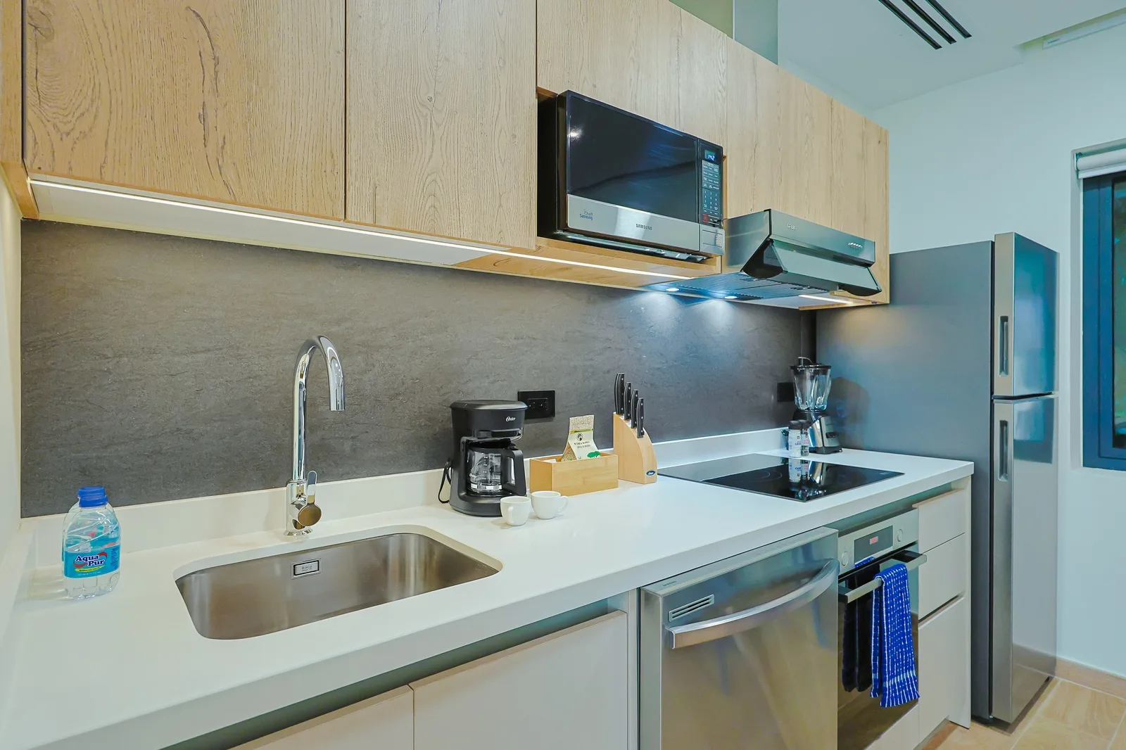 Your fully equipped kitchen features modern appliances, sleek countertops, and everything you need to prepare meals just the way you like them during your stay.
