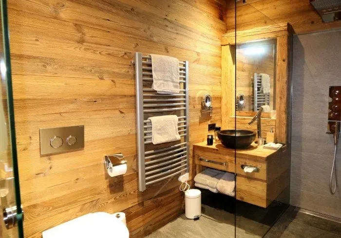 Bathroom with sink, toilet and glass shower.