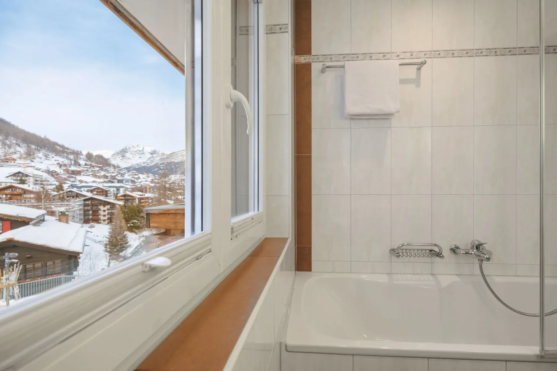 Bathroom with bathtub and shower.