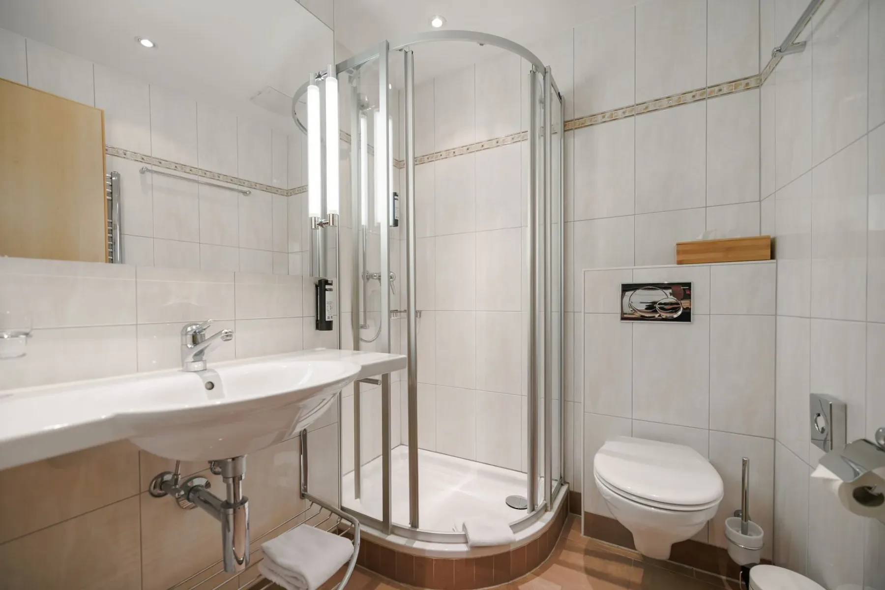 Bathroom with sink and glass shower.