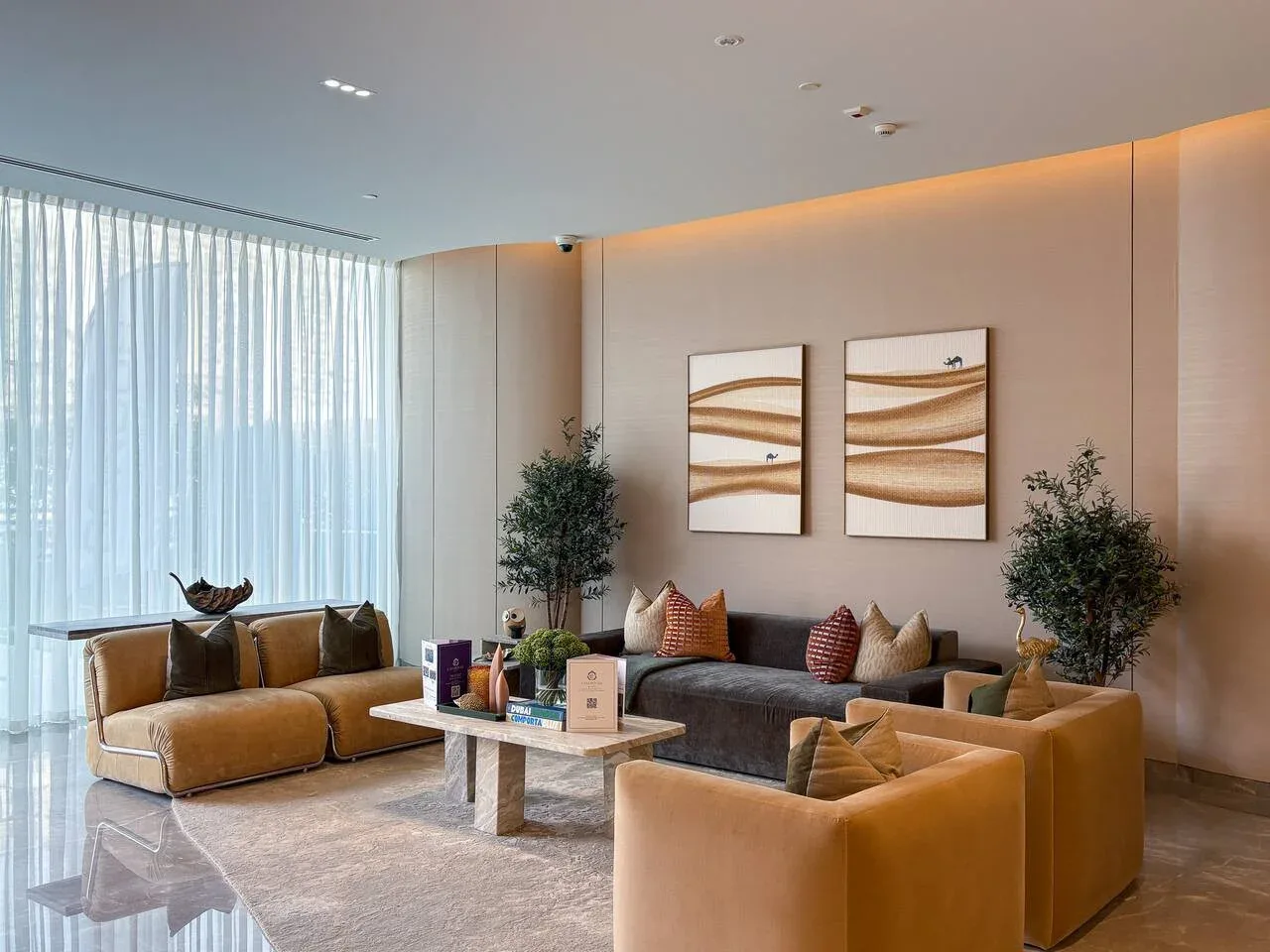 A modern living room with seating arranged around a low coffee table.