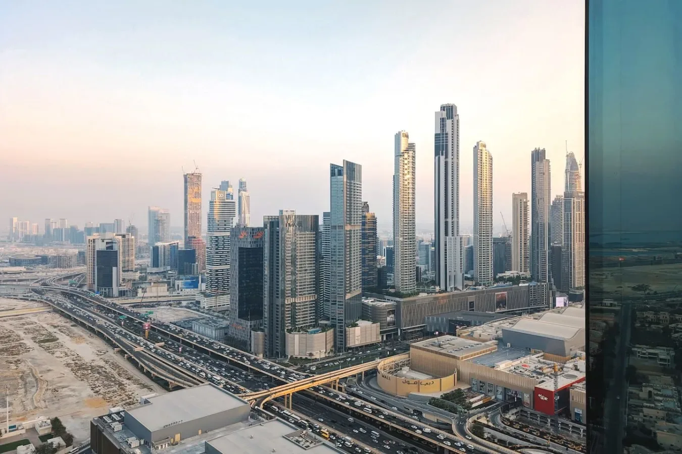 A city skyline of high-rise buildings beside elevated roads.