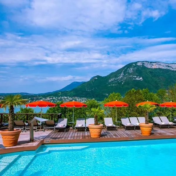 Hotel pool with panoramic lake and mountain views