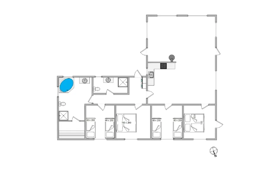Un plano muestra varias habitaciones dispuestas alrededor de una amplia zona central abierta.