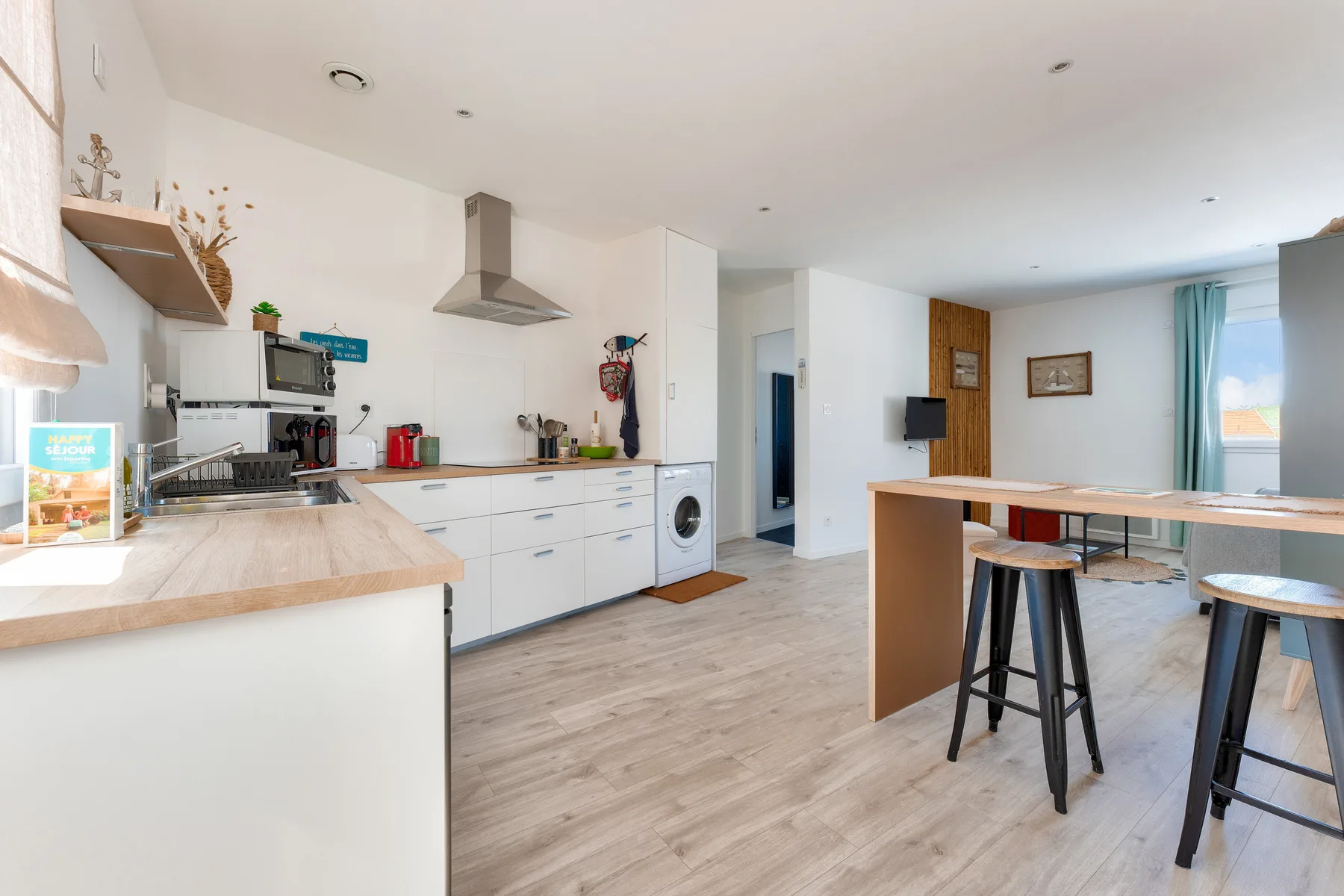 Open-plan studio with a kitchen counter and dining area.