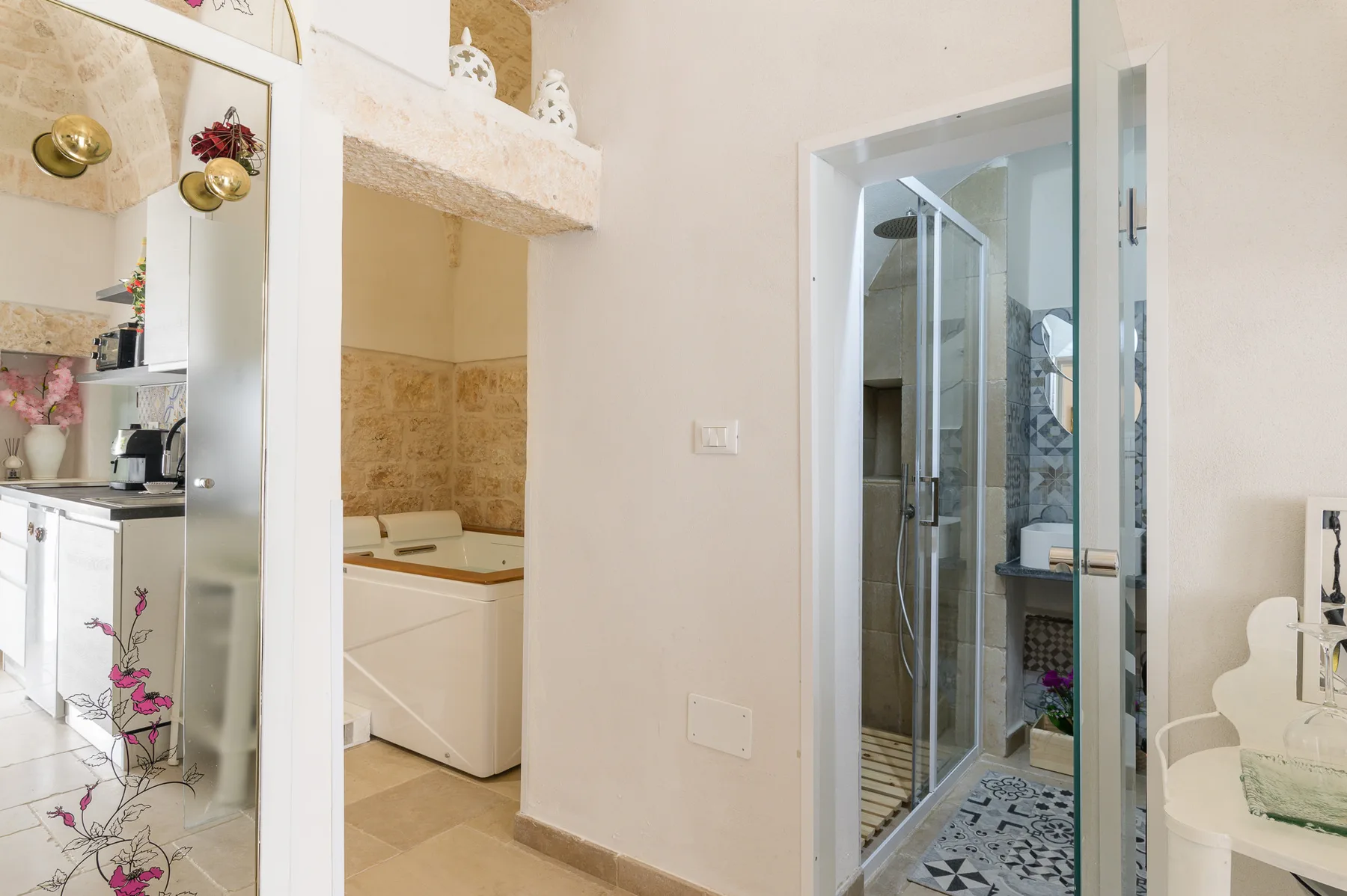 A bathroom with a glass shower and a bathtub.