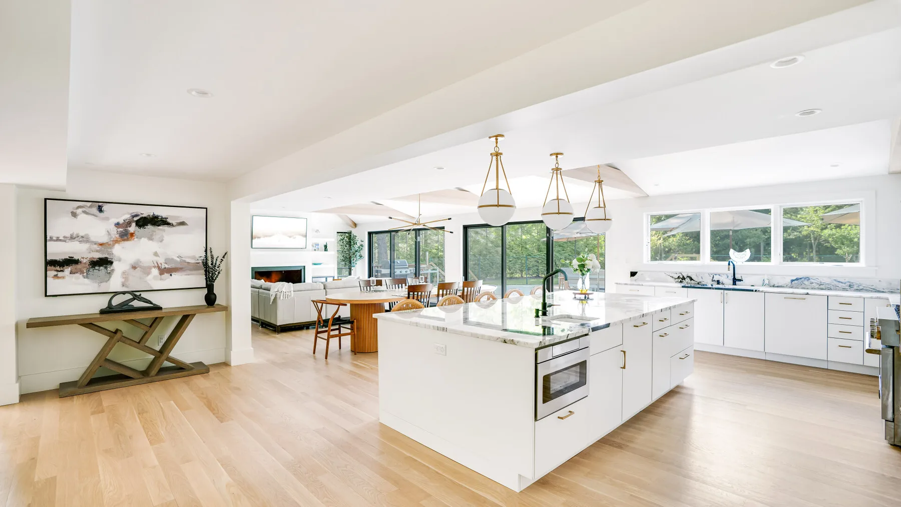 A bright open-plan kitchen and dining area with a large central island.