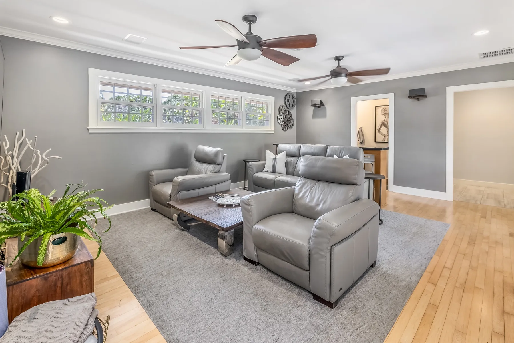 A living room with gray seating arranged around a low coffee table.
