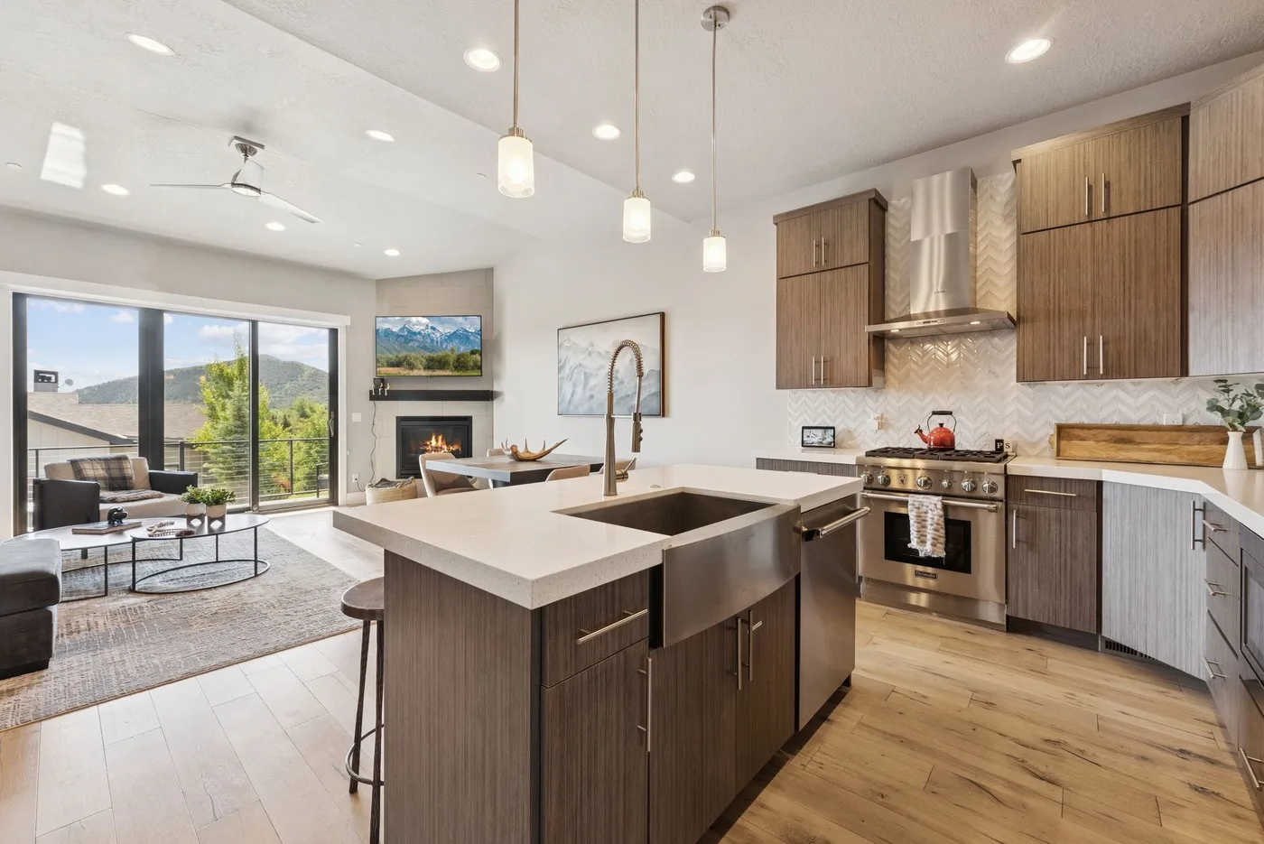 A bright open-plan kitchen and living area with a large central island.