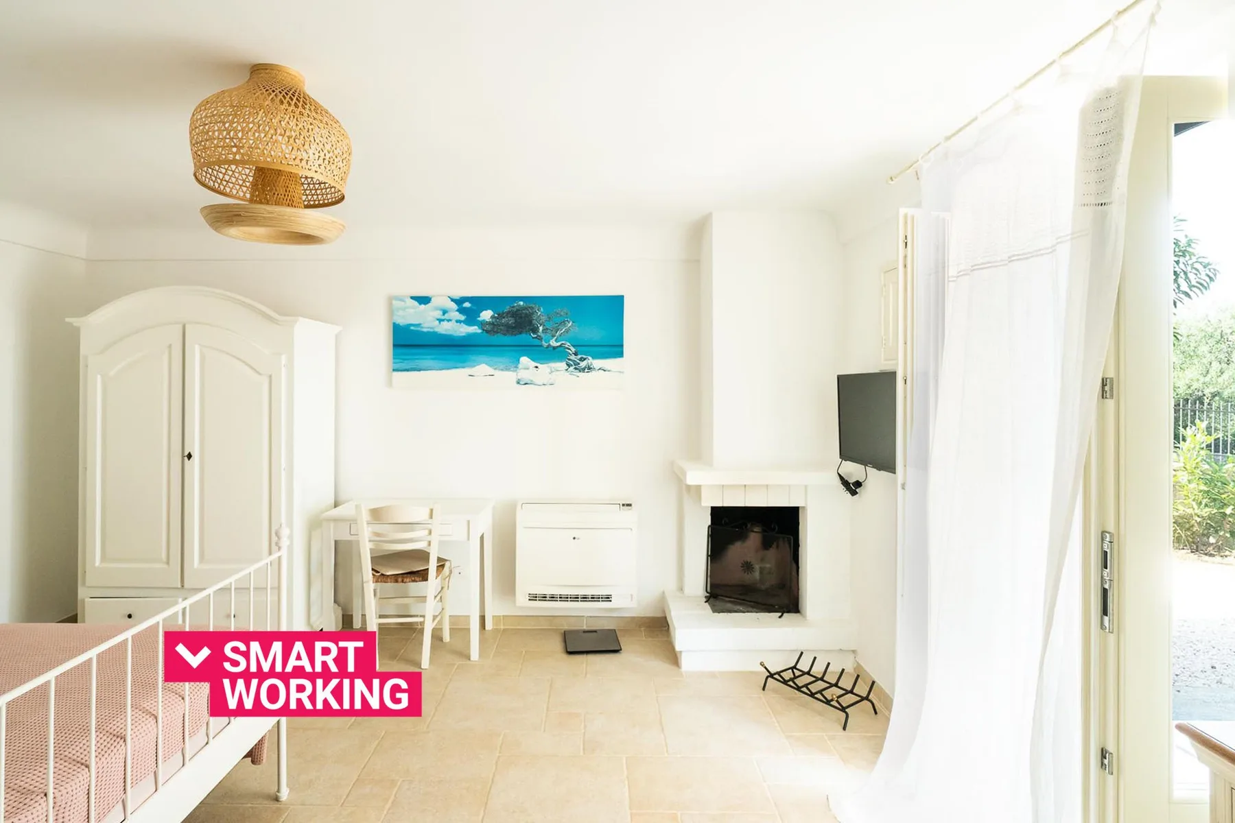 A bright living room with a fireplace and a dining table.