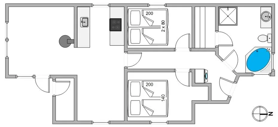 Floor plan showing two sleeping areas, a kitchen, and a bathroom.